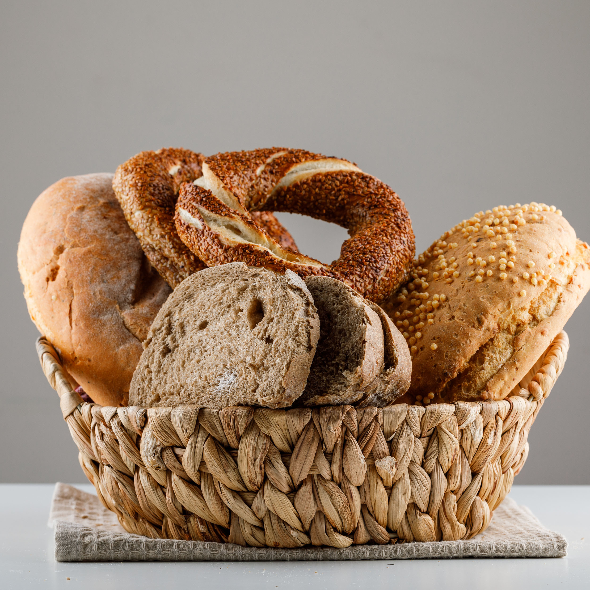 Sliced bread with turkish bagel side view on a white and gray background
