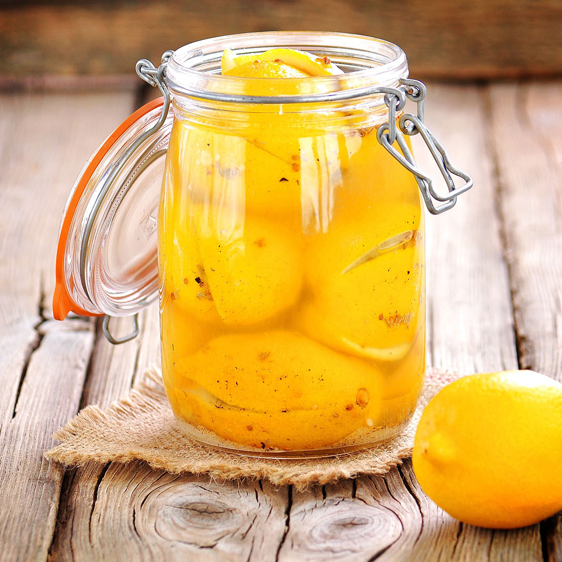 Preserved lemons with sea salt and spices. Moroccan cuisine. Vintage style.